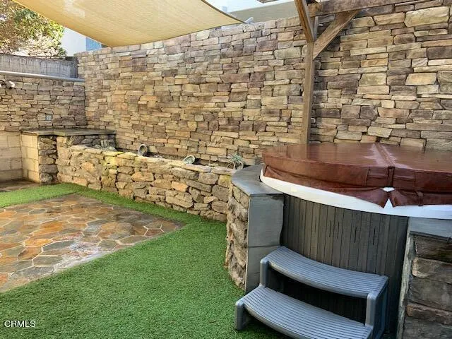 a kitchen with stainless steel appliances granite countertop a refrigerator and a stove