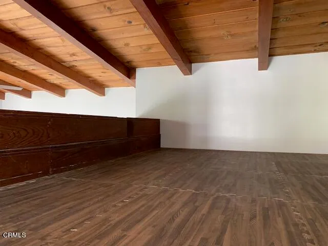 a view of outdoor space with wooden floor