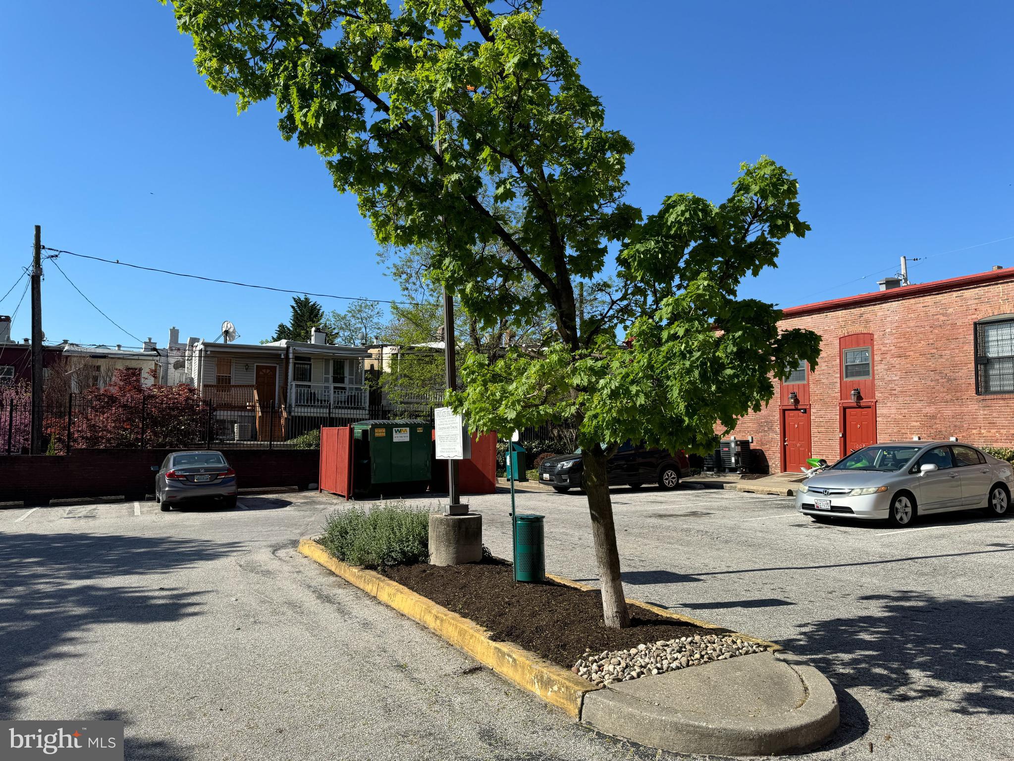 1011 Hunter Street, Unit B4 Baltimore, MD 21202 - Photo 15 of 17 a street view with couple of cars parked on road