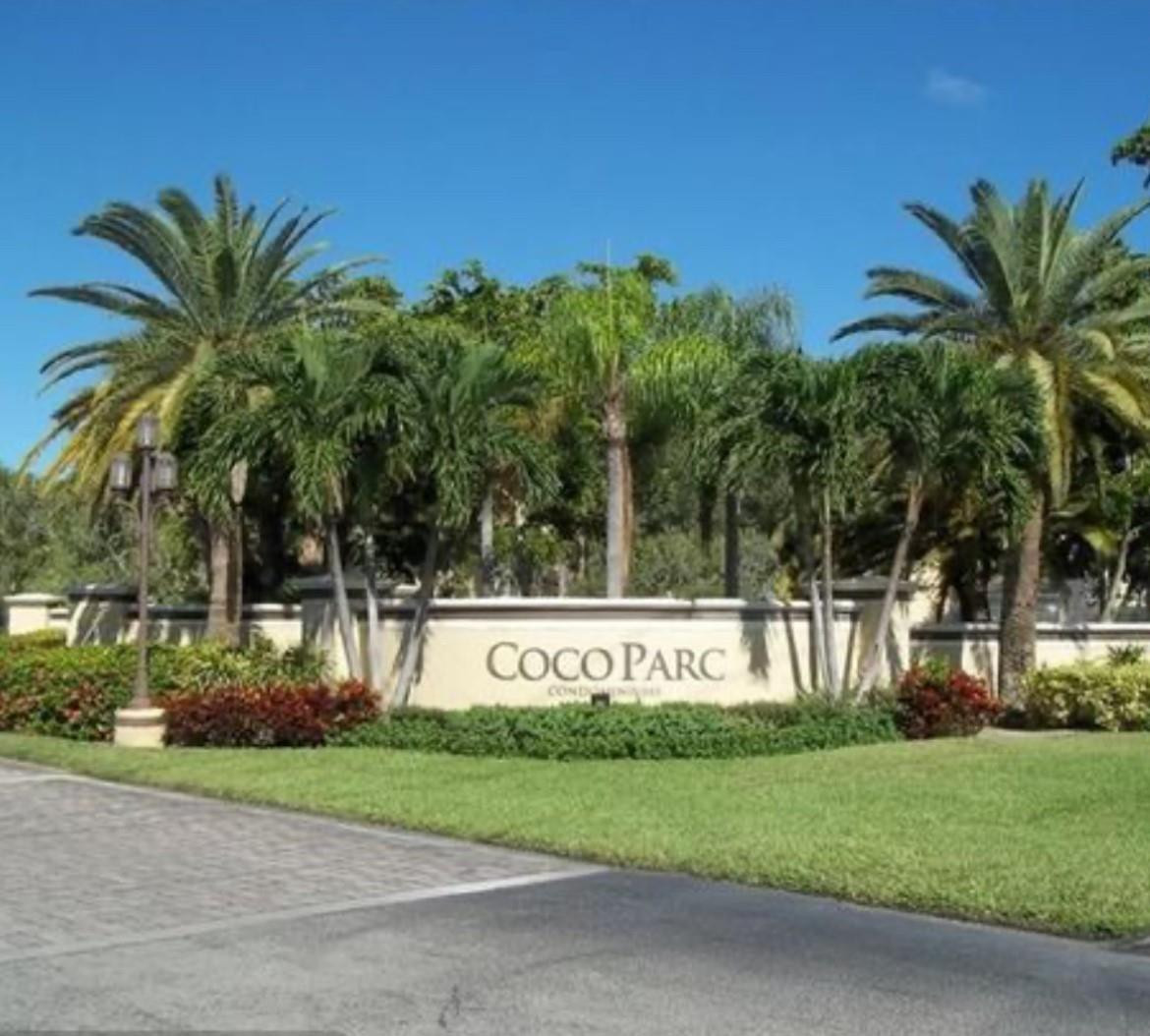 921 Lyons Road, Unit 3105 Coconut Creek, FL 33063 - Photo 1 of 28 a sign that is sitting in front of a house with a big yard