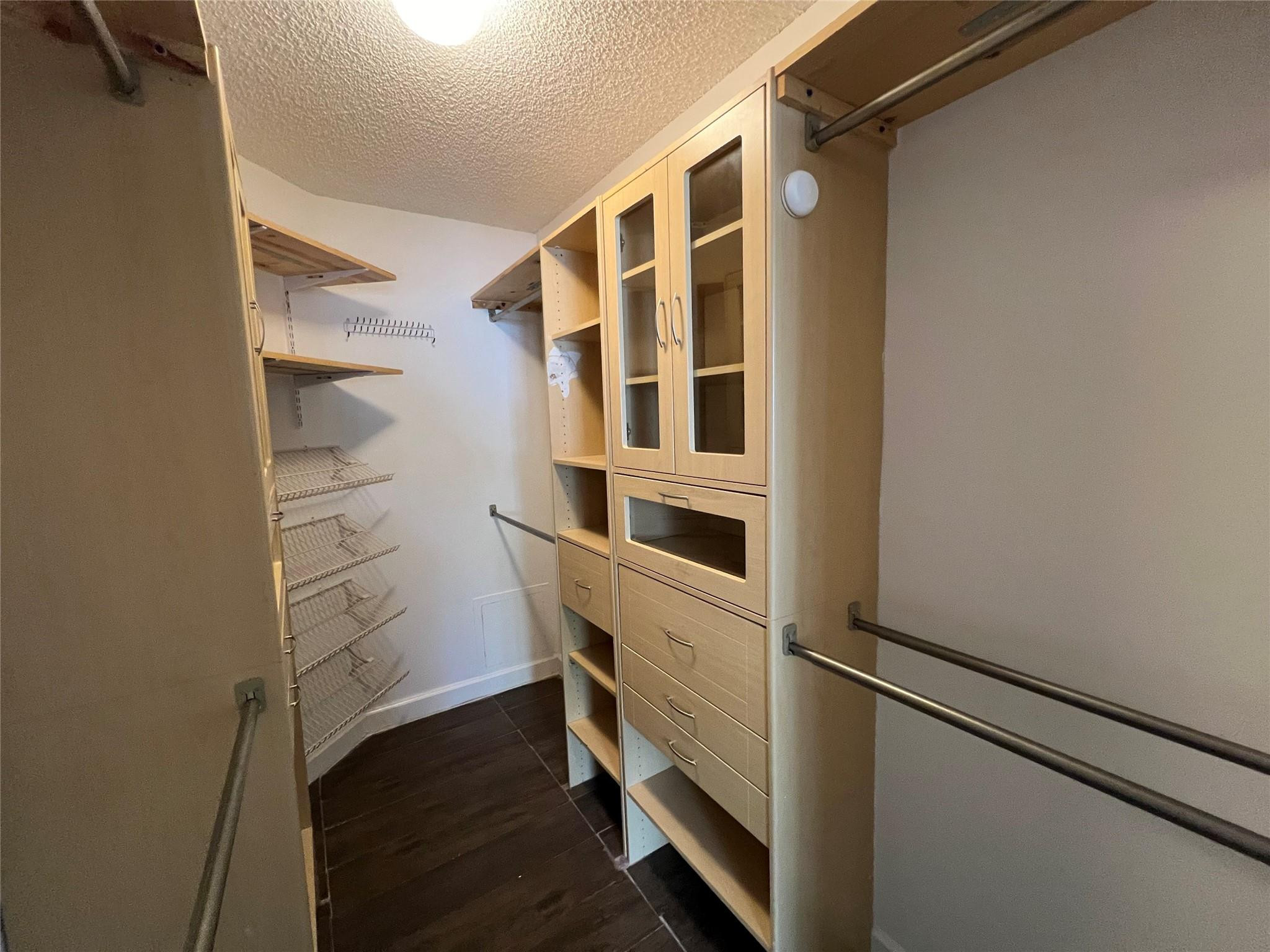 921 Lyons Road, Unit 3105 Coconut Creek, FL 33063 - Photo 12 of 28 a view of walk in closet with empty racks