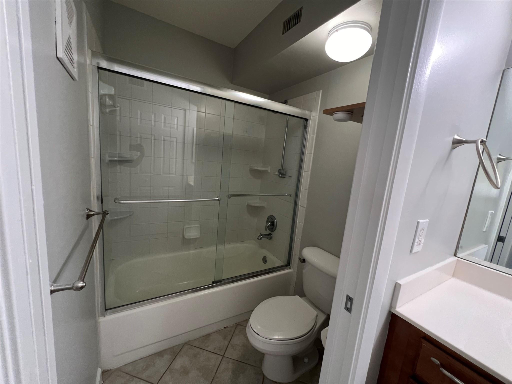 921 Lyons Road, Unit 3105 Coconut Creek, FL 33063 - Photo 21 of 28 a bathroom with a shower and a toilet