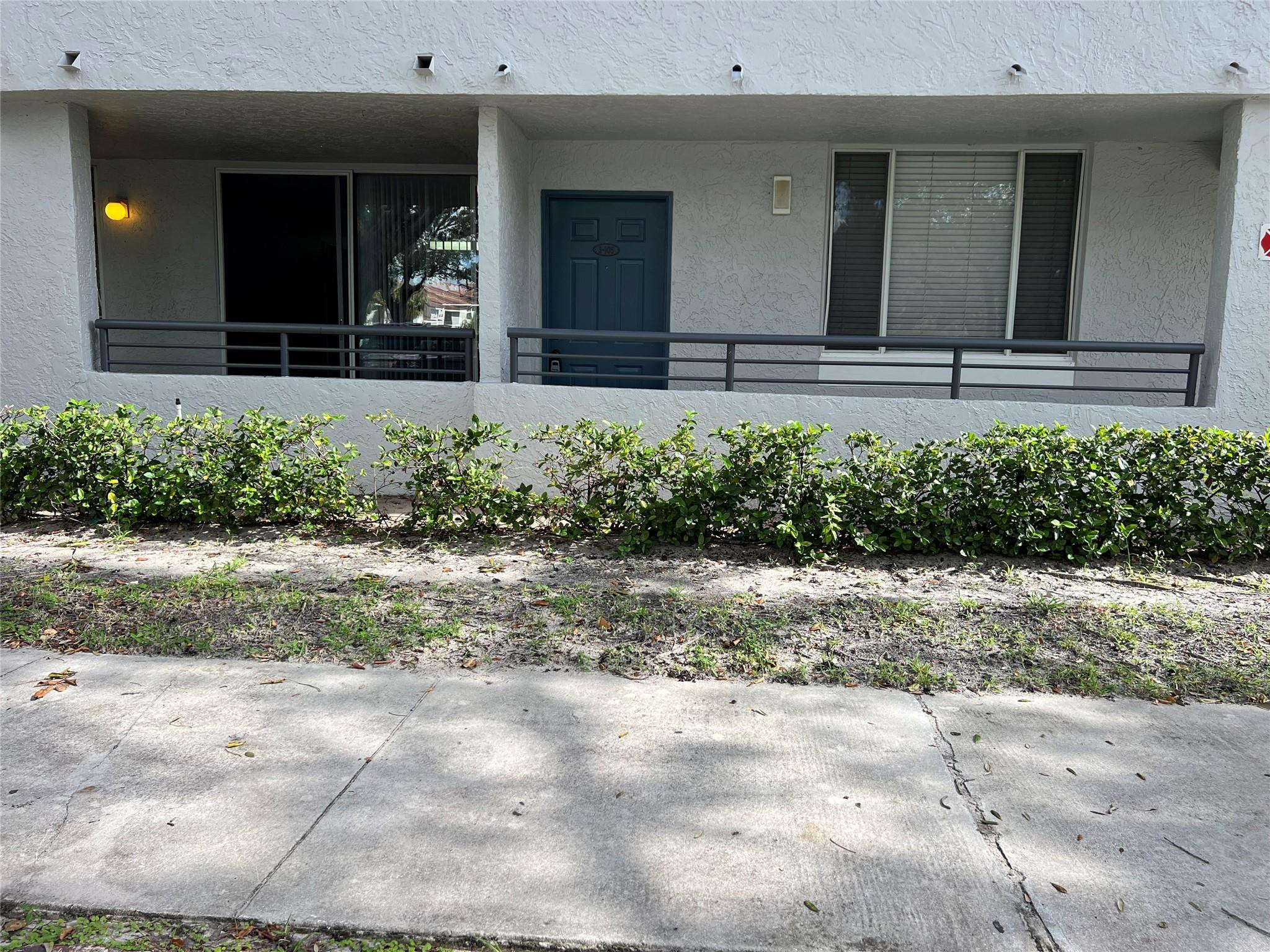 921 Lyons Road, Unit 3105 Coconut Creek, FL 33063 - Photo 25 of 28 a view of a backyard of the house