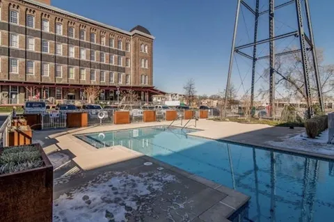 a view of swimming pool with outdoor seating
