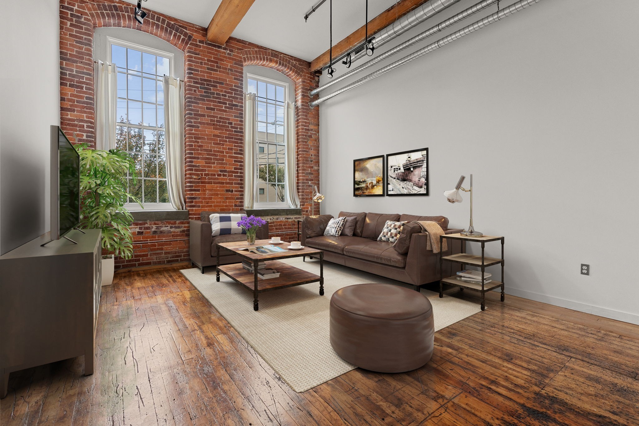1350 Rosa L Parks Boulevard, Unit 347 Nashville, TN 37208 - Photo 2 of 27 a living room with furniture and a potted plant