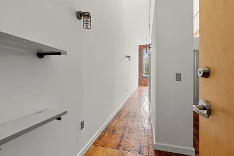 a view of a hallway with closet