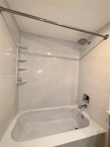 a close view of a bathtub in a bathroom