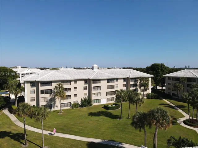 a front view of a house with a yard table and chairs