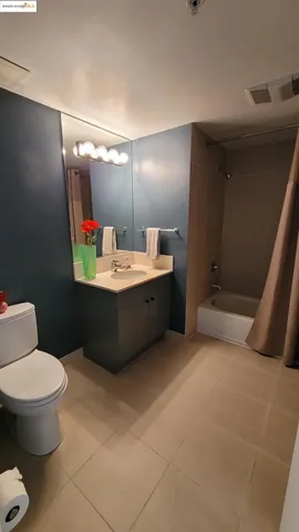 a bedroom with a bed and lamp