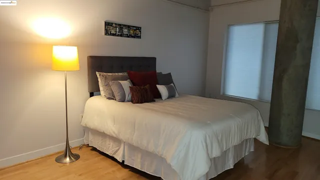 a bedroom with a bed and furniture