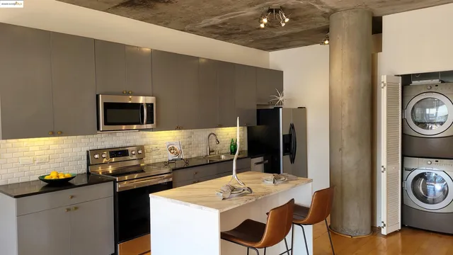a kitchen with a sink a stove and cabinets
