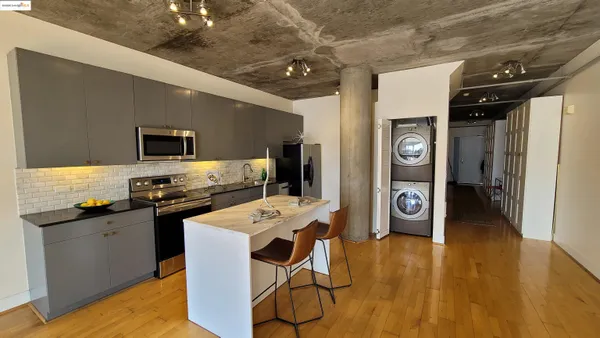 a kitchen that has a sink and a stove in it