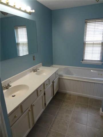 1052 Shadowbrook Drive Greenbrier, TN 37073 - Photo 7 of 20 Master bath has new tile flooring, double sinks, jaccuzi tub.