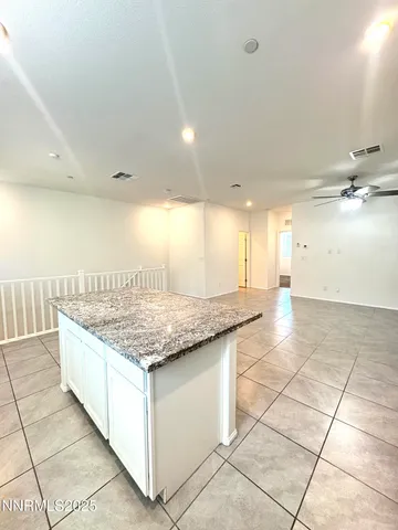 a view of kitchen with refrigerator cabinets and outdoor view