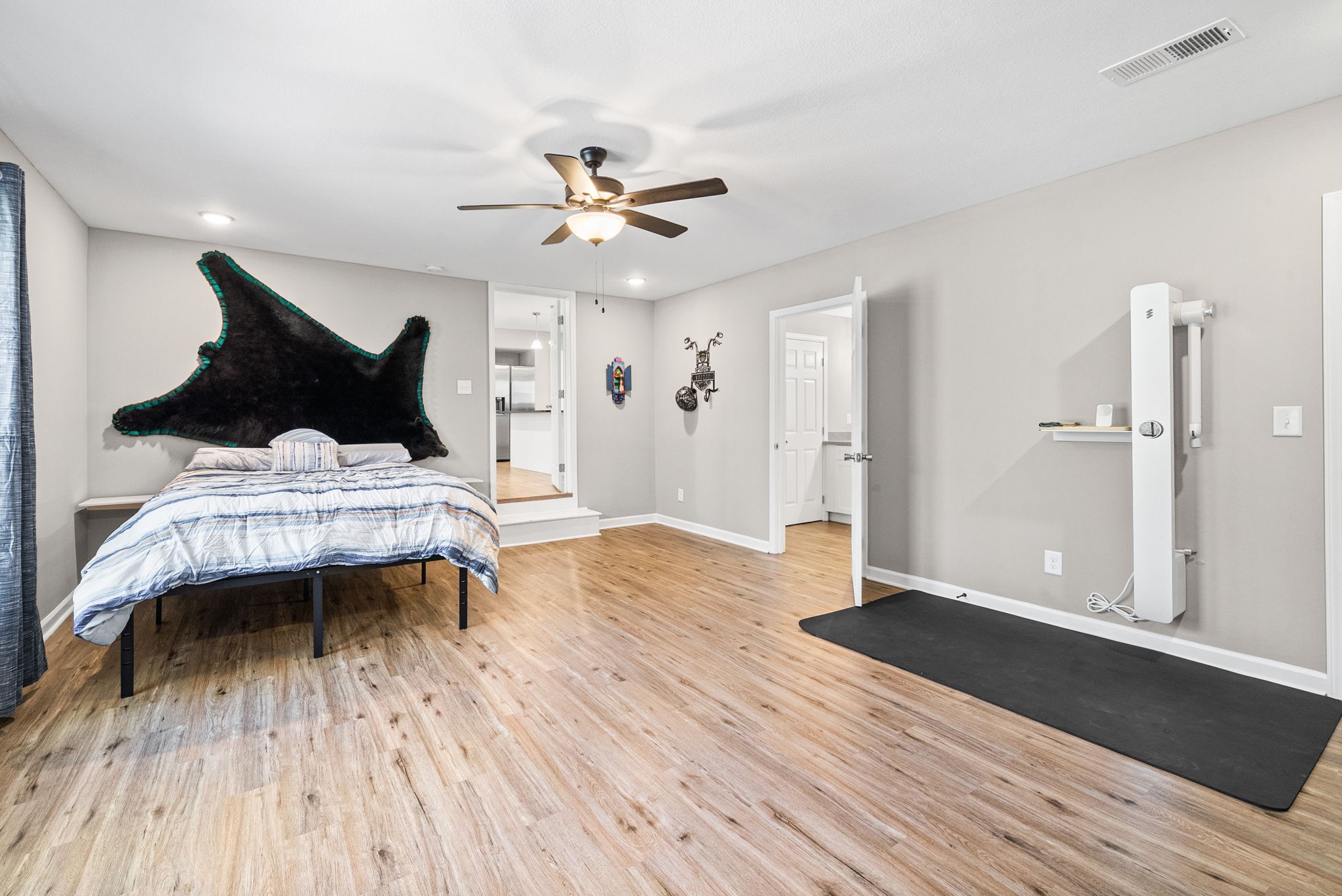 138 Walker Ridge Road Big Rock, TN 37023 - Photo 17 of 37 a bedroom with a bed and a chandelier