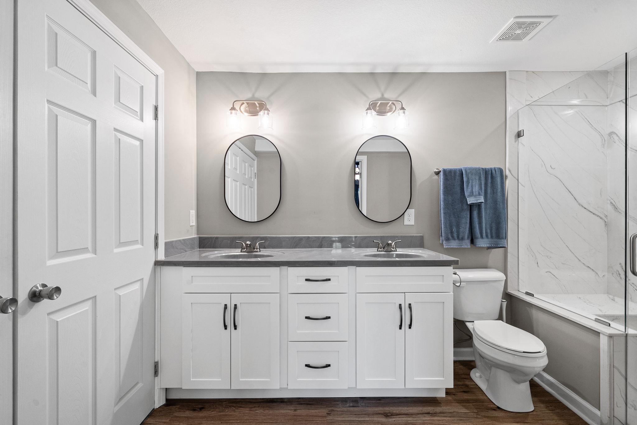 138 Walker Ridge Road Big Rock, TN 37023 - Photo 18 of 37 a bathroom with a granite countertop toilet a sink and a mirror