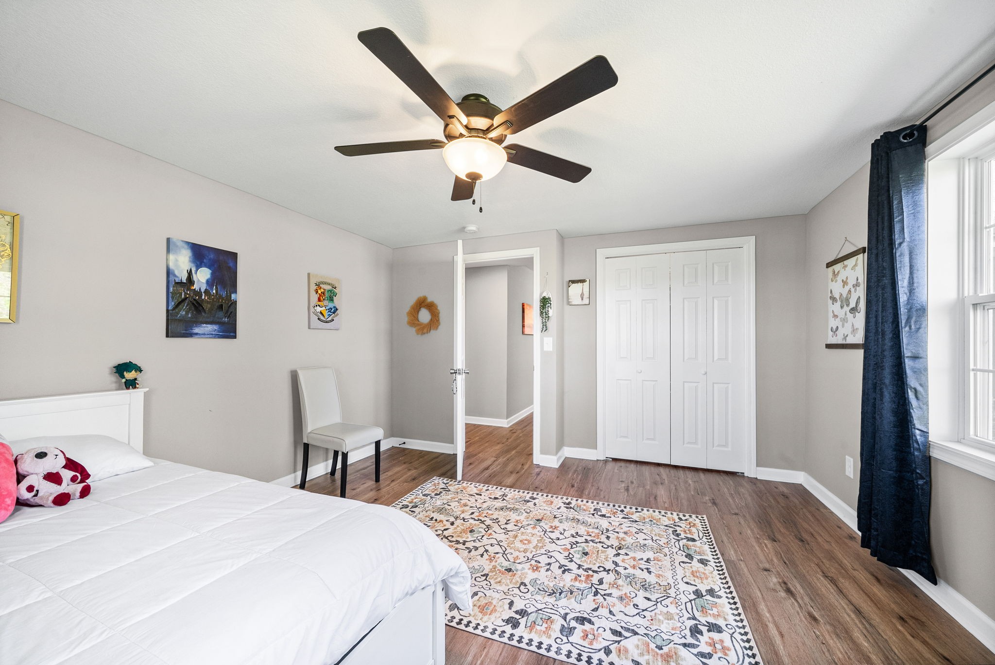 138 Walker Ridge Road Big Rock, TN 37023 - Photo 25 of 37 a bedroom with a bed and a chandelier