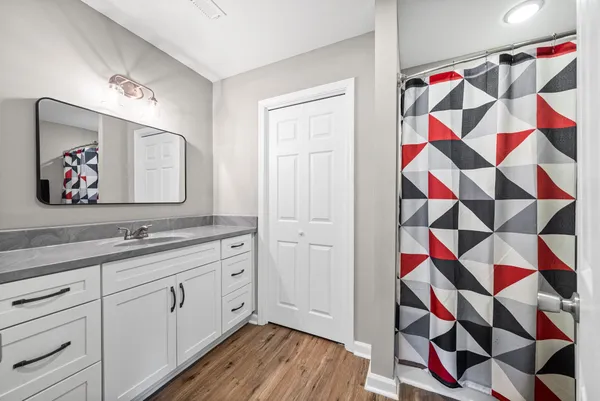a bathroom with a sink a vanity and a mirror