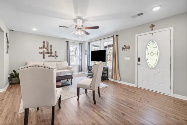 a view of a dining room with furniture window and wooden floor