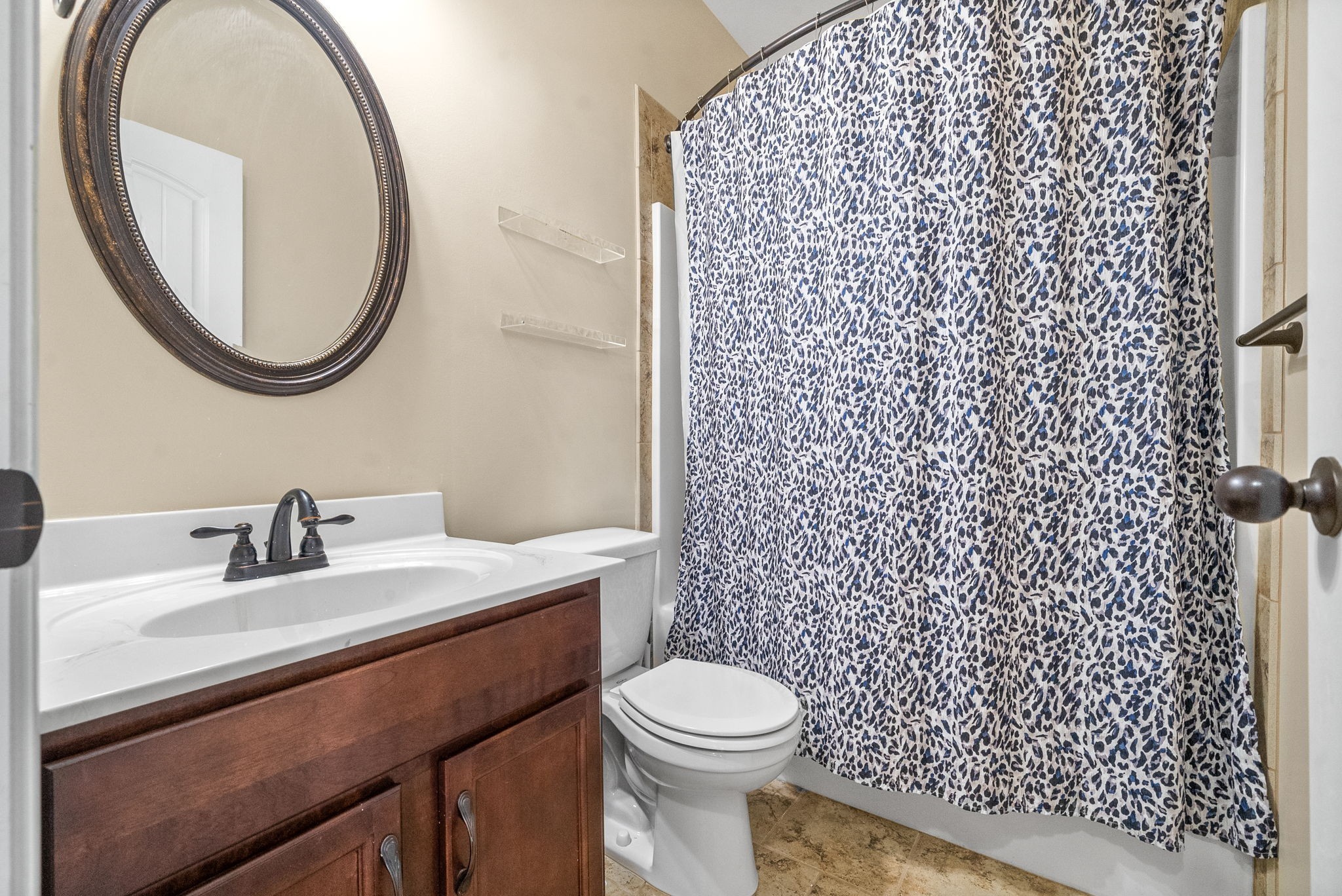 3349 Wiser Drive Clarksville, TN 37042 - Photo 16 of 40 a bathroom with a sink a toilet and a mirror