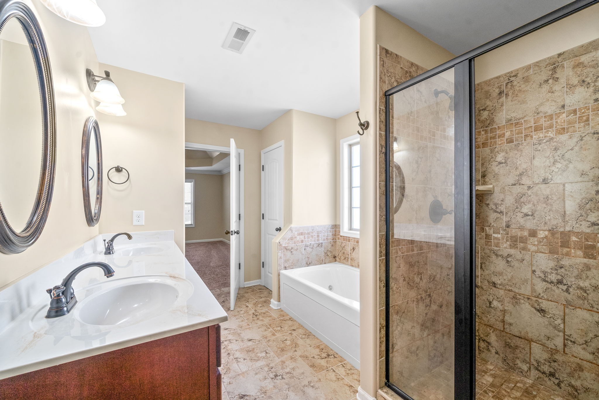 3349 Wiser Drive Clarksville, TN 37042 - Photo 30 of 40 a bathroom with a granite countertop sink mirror and shower