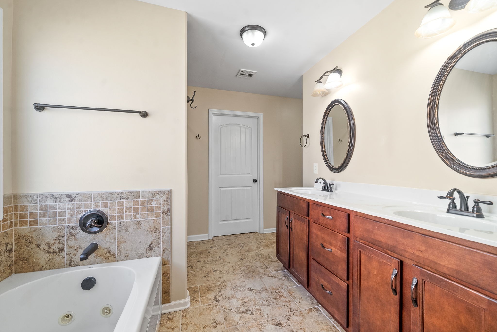 3349 Wiser Drive Clarksville, TN 37042 - Photo 31 of 40 a bathroom with a double vanity sink mirror and shower