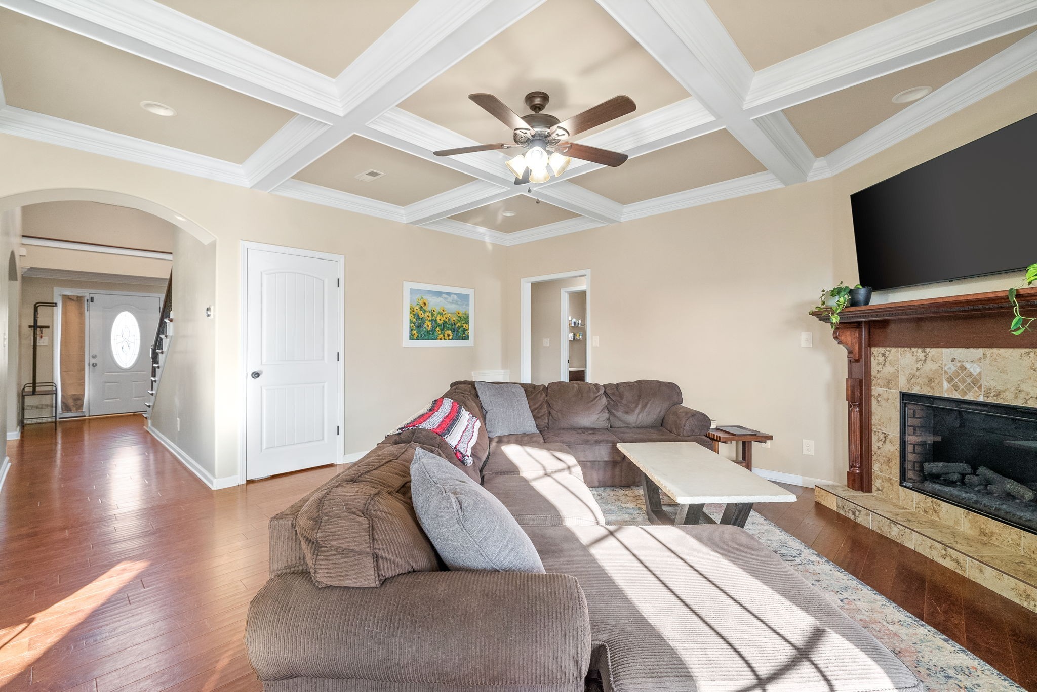 3349 Wiser Drive Clarksville, TN 37042 - Photo 9 of 40 a living room with furniture a flat screen tv and a fireplace
