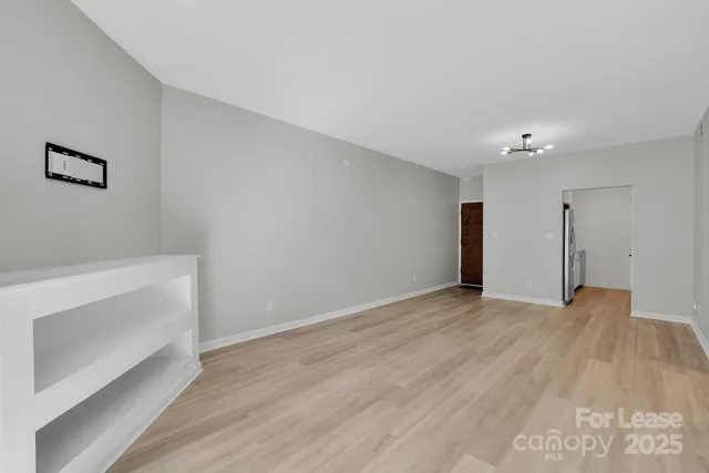a kitchen with stainless steel appliances granite countertop white cabinets and white appliances