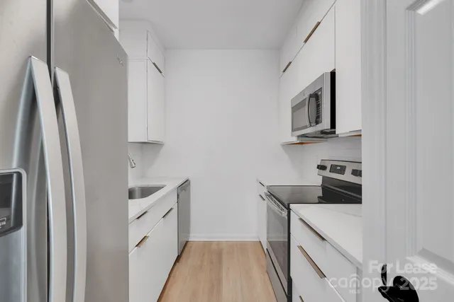 a kitchen with a microwave and a stove