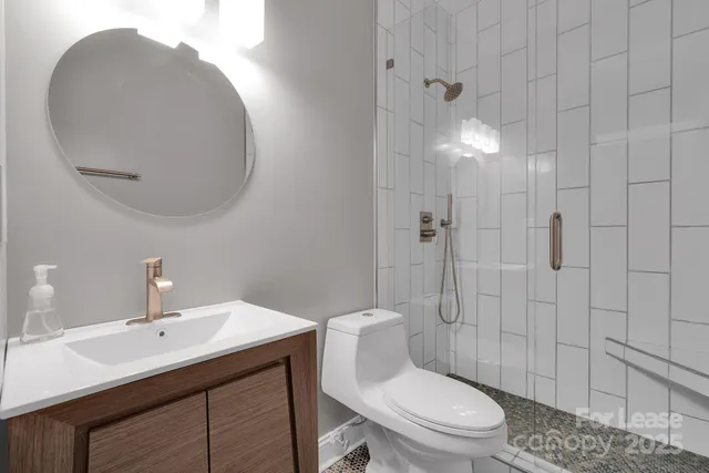 a bathroom with a sink vanity and mirror
