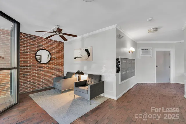 a view of a kitchen with refrigerator and window