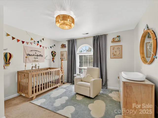 a bedroom with furniture and a window