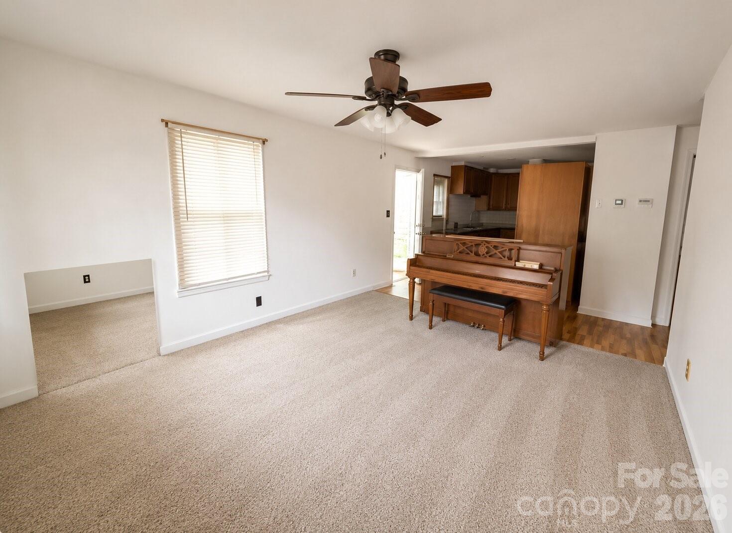 405 Isom Street Lancaster, SC 29720 - Photo 4 of 8 a living room with furniture and a window