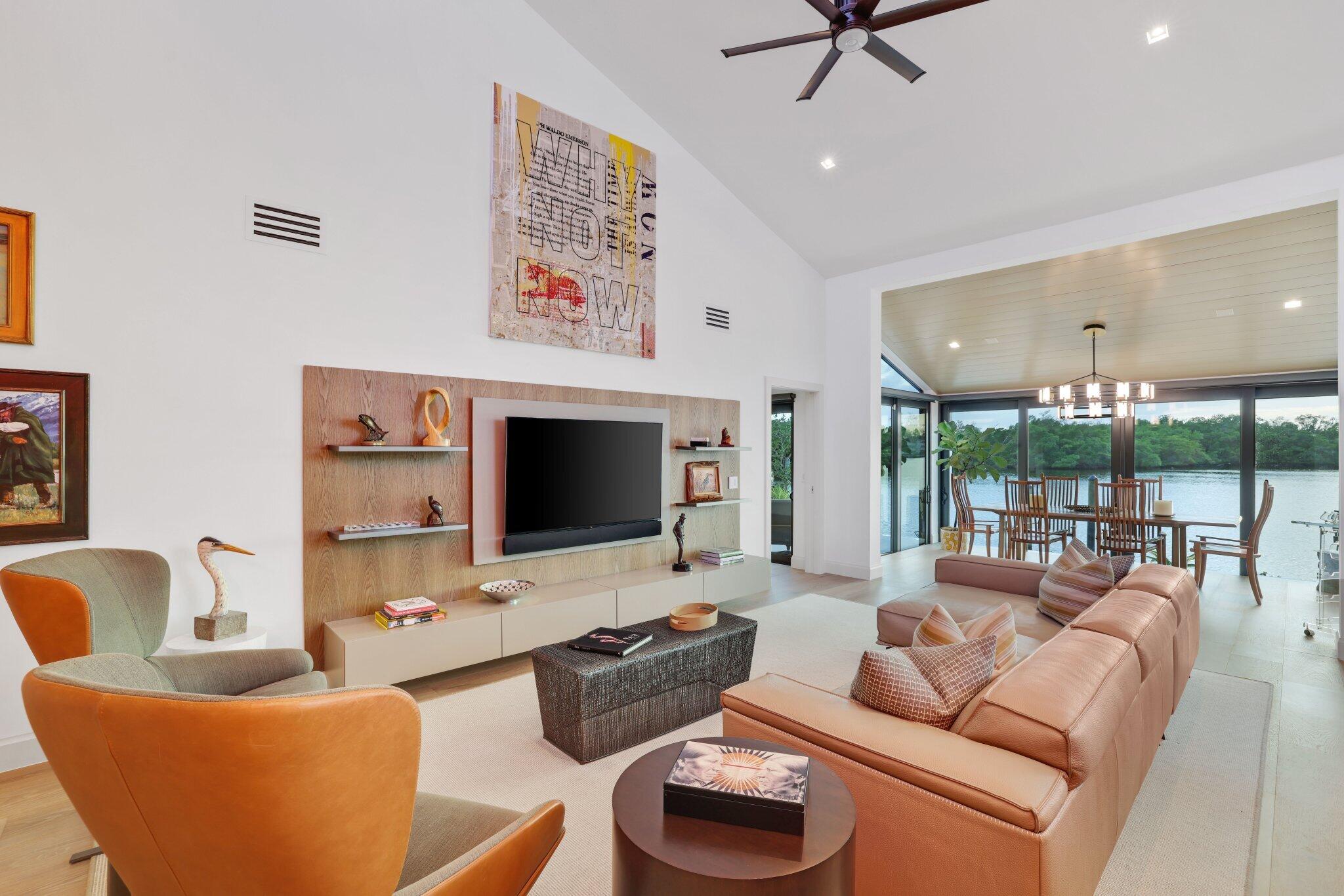 6110 North Ocean Boulevard, Unit 39 Ocean Ridge, FL 33435 - Photo 13 of 59 a living room with furniture and a flat screen tv
