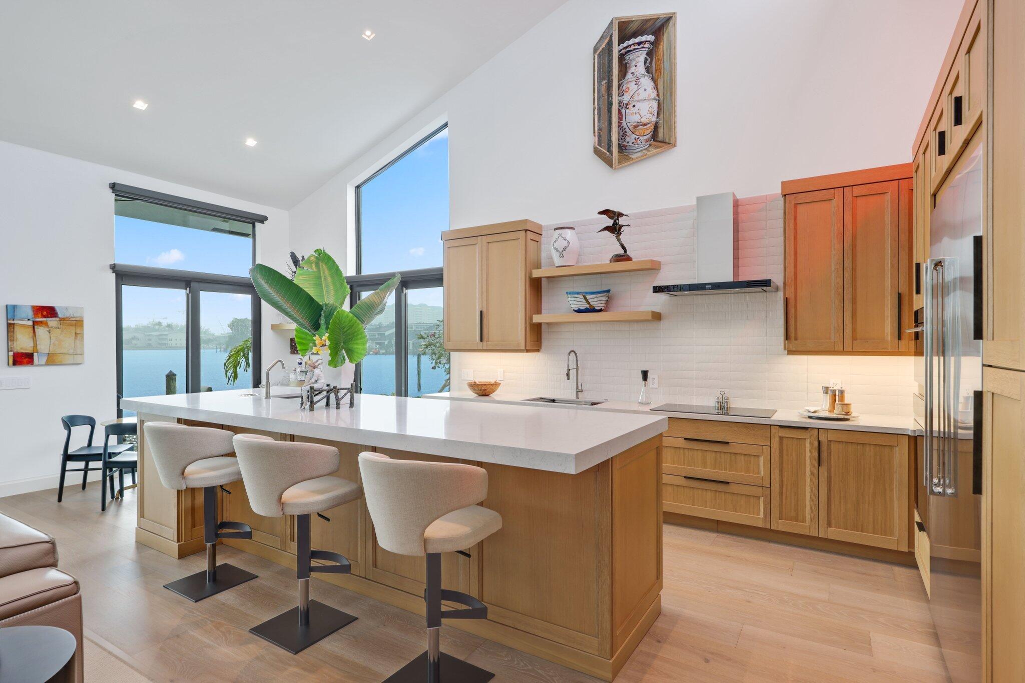 6110 North Ocean Boulevard, Unit 39 Ocean Ridge, FL 33435 - Photo 17 of 59 a kitchen with a sink and cabinets