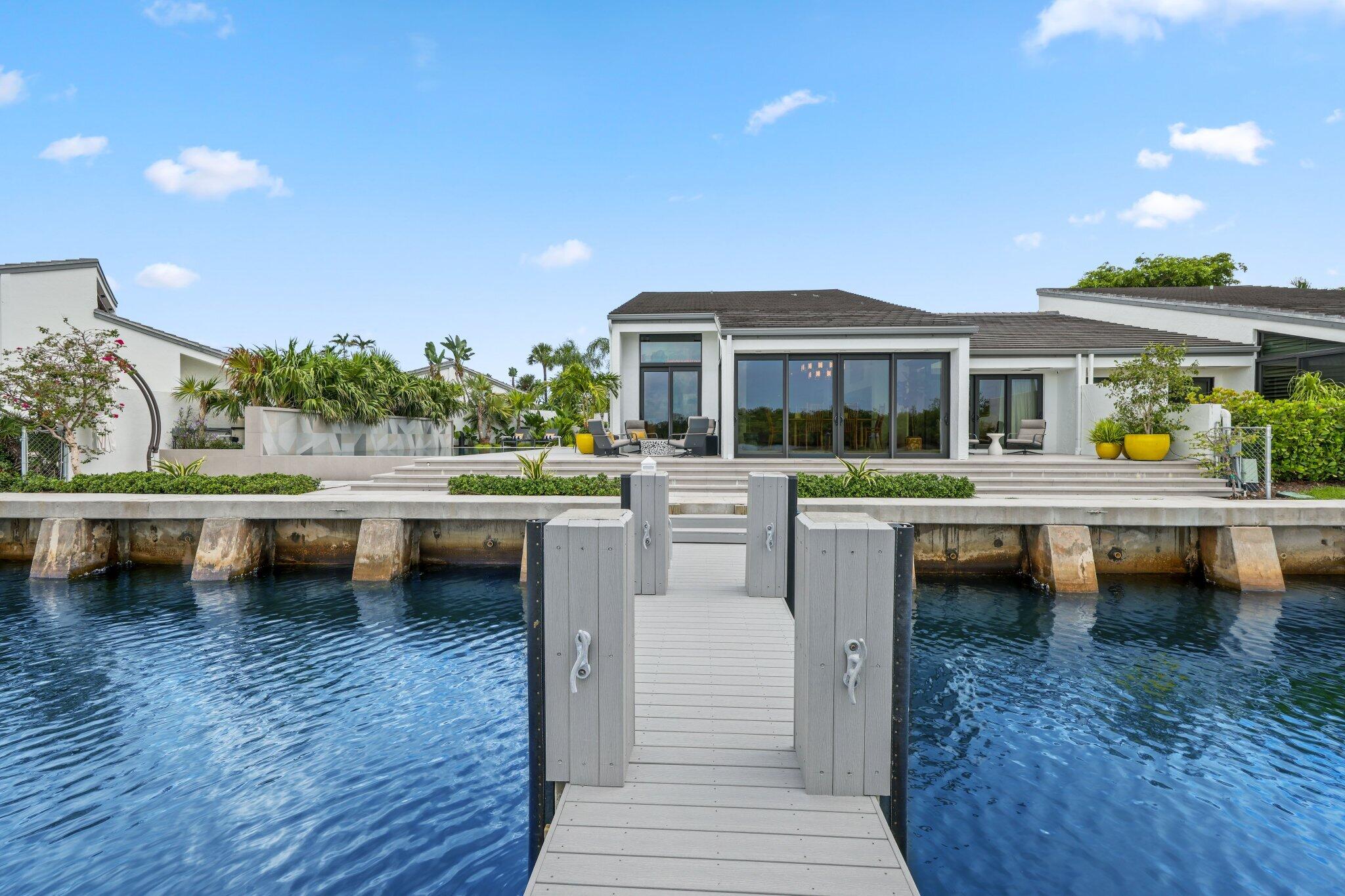 6110 North Ocean Boulevard, Unit 39 Ocean Ridge, FL 33435 - Photo 2 of 59 a view of house with swimming pool and outdoor seating