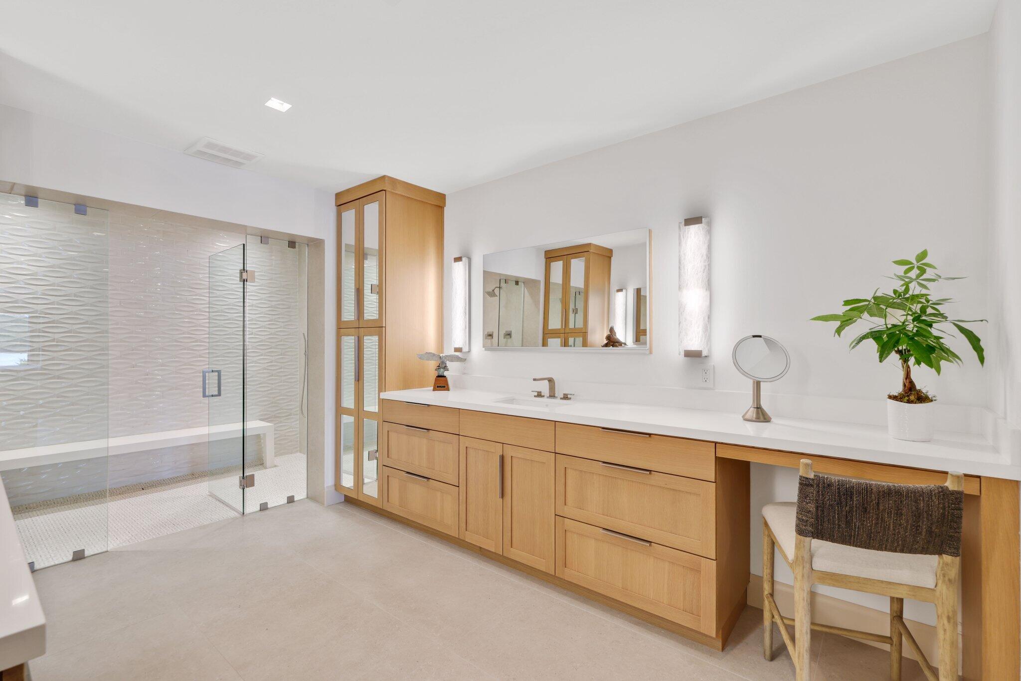 6110 North Ocean Boulevard, Unit 39 Ocean Ridge, FL 33435 - Photo 29 of 59 a spacious bathroom with a double vanity sink a mirror and a bathtub
