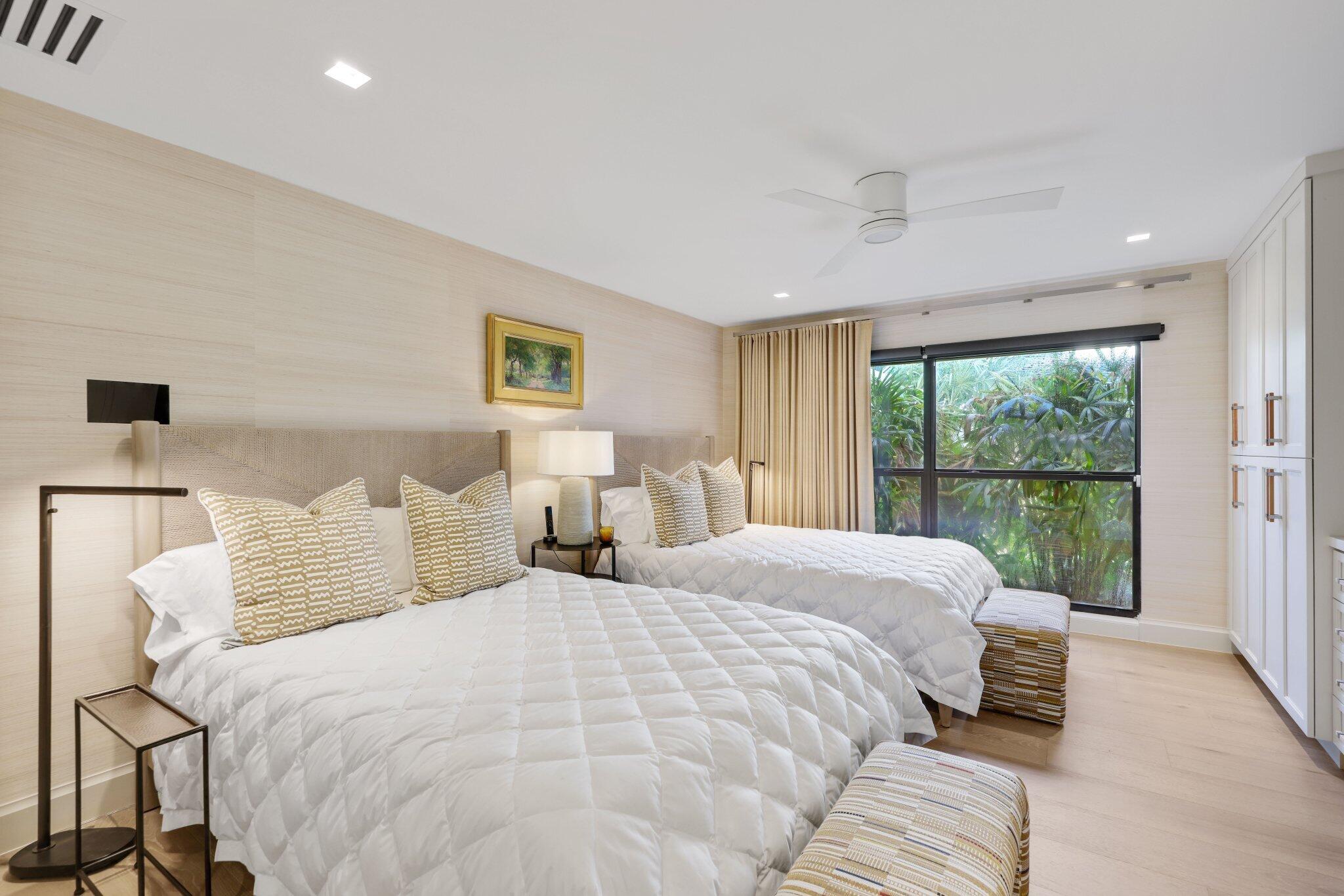 6110 North Ocean Boulevard, Unit 39 Ocean Ridge, FL 33435 - Photo 32 of 59 a bedroom with a large bed and a large window