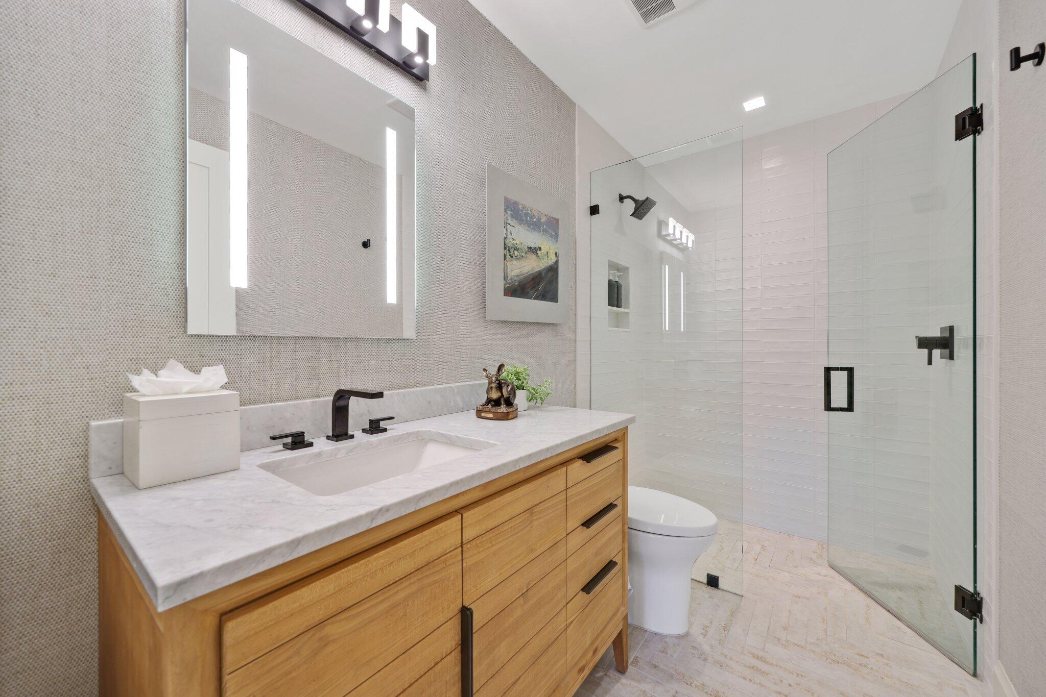 6110 North Ocean Boulevard, Unit 39 Ocean Ridge, FL 33435 - Photo 33 of 59 a bathroom with a sink toilet and shower