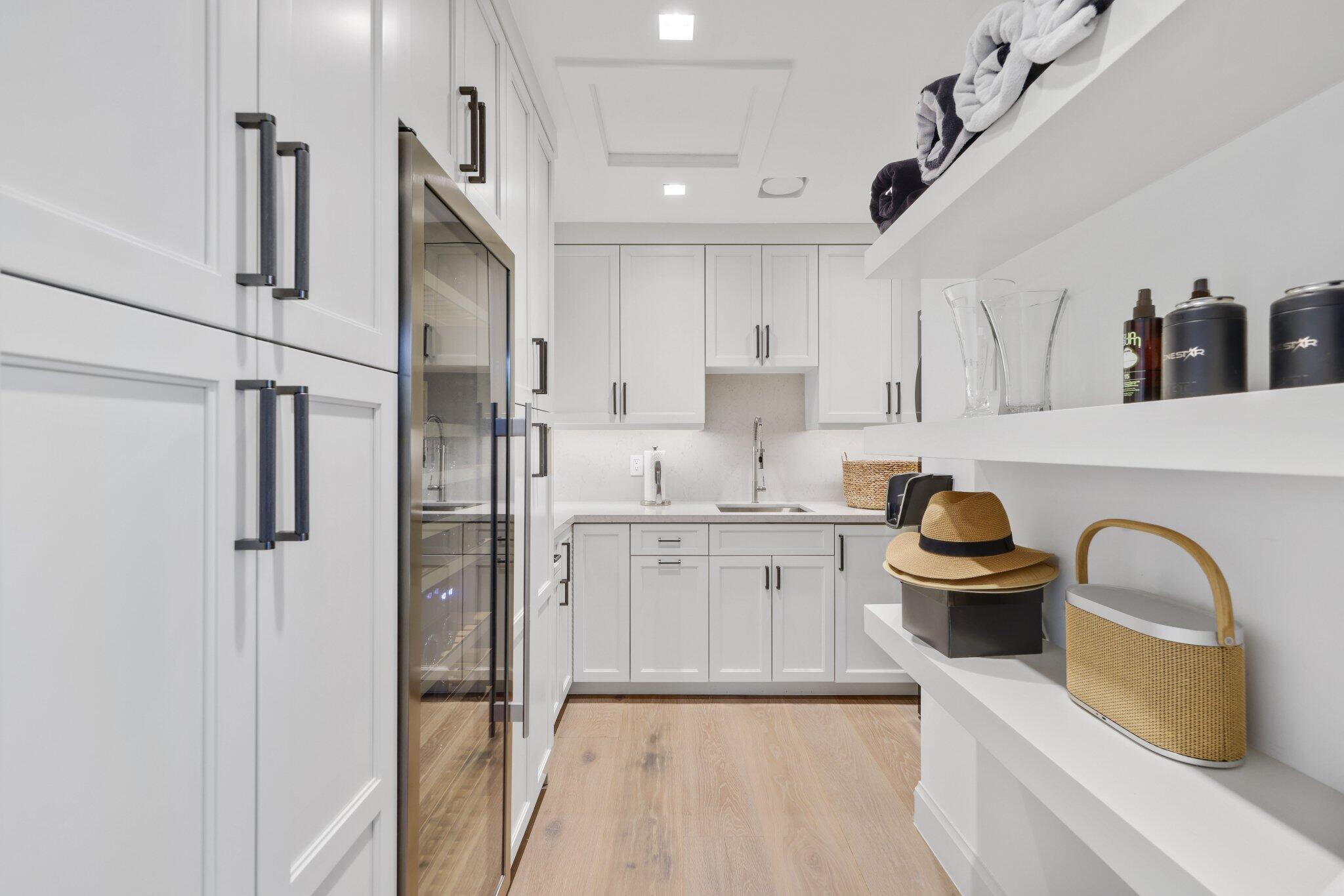 6110 North Ocean Boulevard, Unit 39 Ocean Ridge, FL 33435 - Photo 37 of 59 a kitchen with stainless steel appliances a sink a stove and cabinets