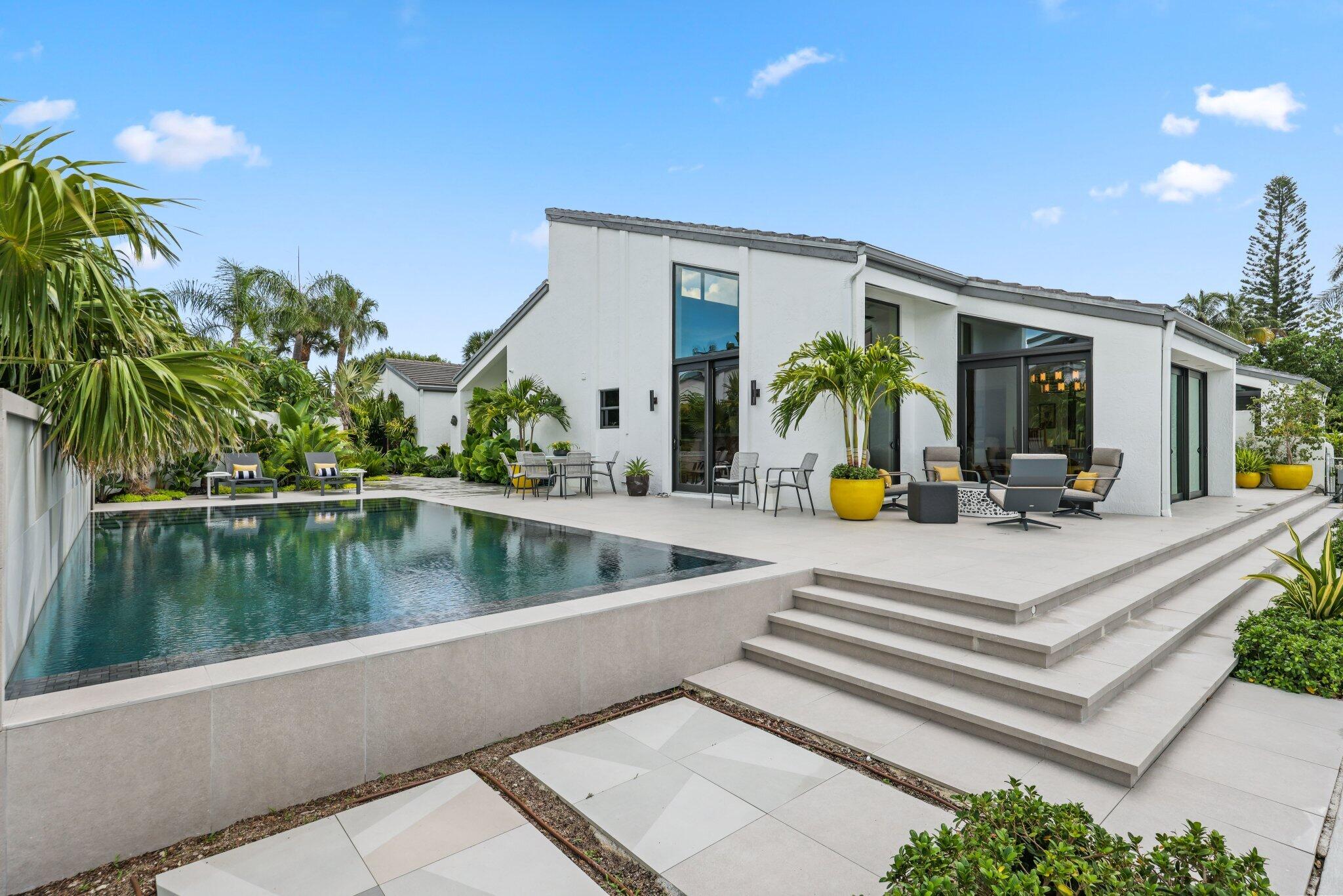 6110 North Ocean Boulevard, Unit 39 Ocean Ridge, FL 33435 - Photo 41 of 59 a view of swimming pool with sitting area