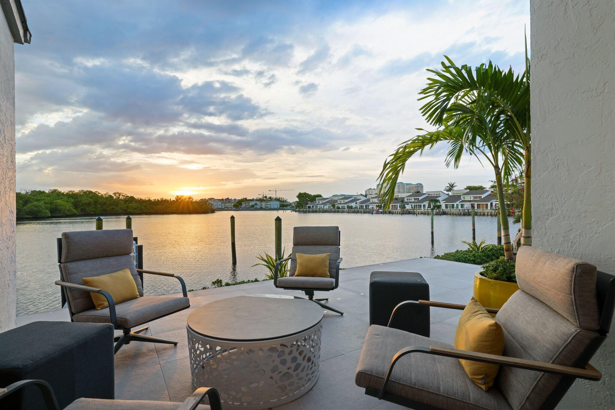 6110 North Ocean Boulevard, Unit 39 Ocean Ridge, FL 33435 - Photo 44 of 59 a balcony with furniture and a potted plant