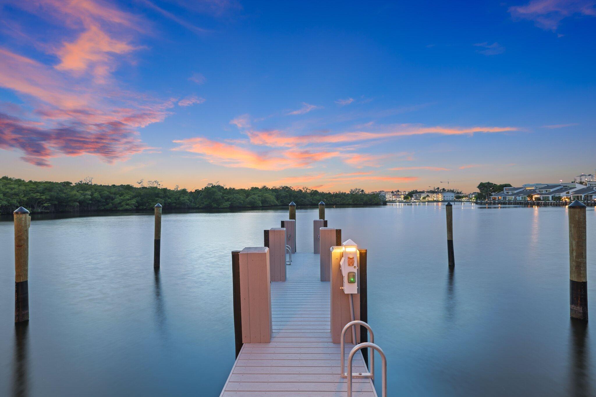 6110 North Ocean Boulevard, Unit 39 Ocean Ridge, FL 33435 - Photo 51 of 59 a view of a lake with houses in the back