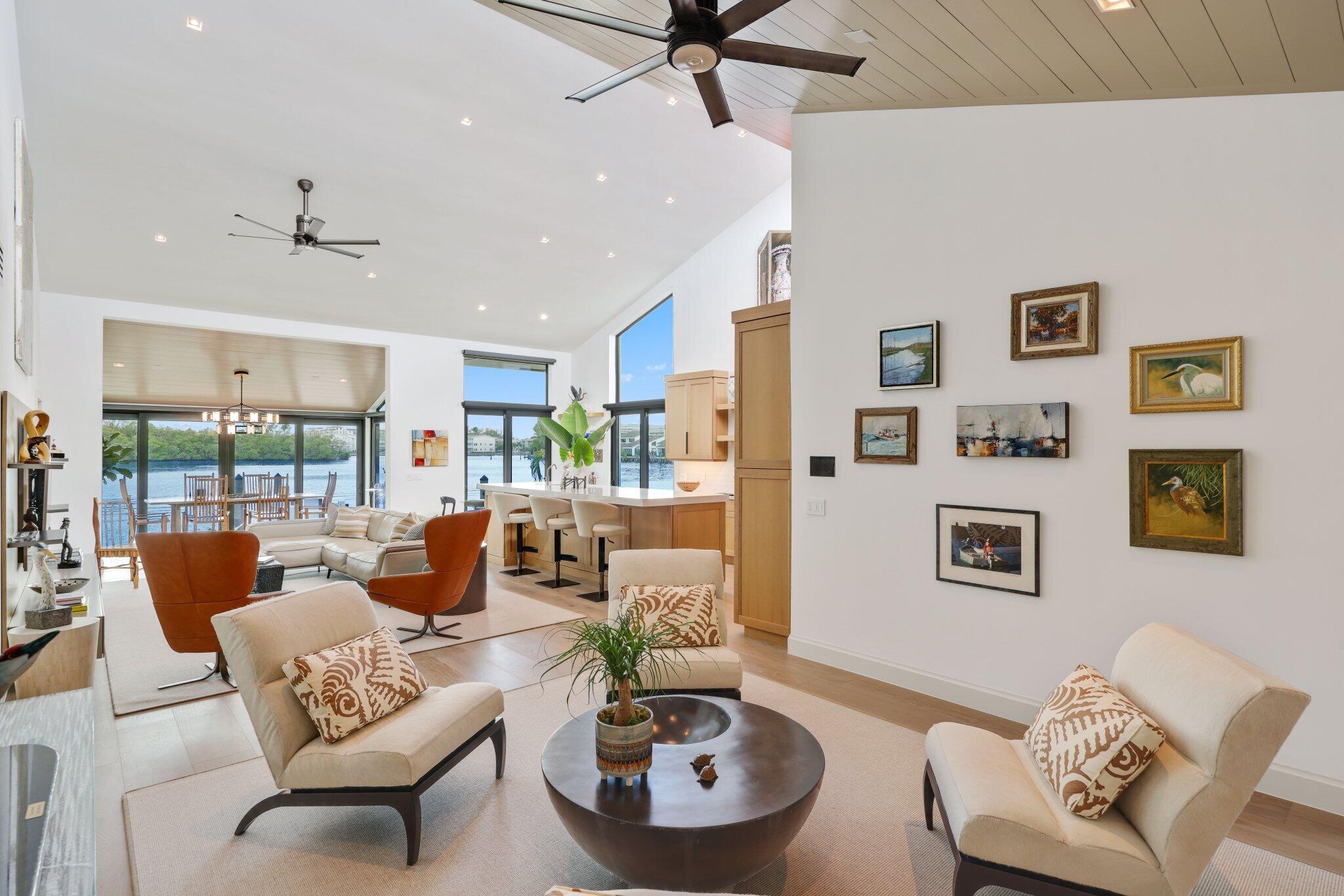 6110 North Ocean Boulevard, Unit 39 Ocean Ridge, FL 33435 - Photo 8 of 59 a living room with furniture and a large window