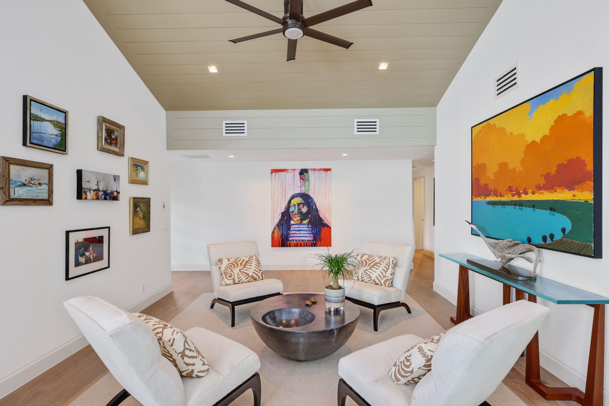 6110 North Ocean Boulevard, Unit 39 Ocean Ridge, FL 33435 - Photo 9 of 59 a living room with furniture and a flat screen tv