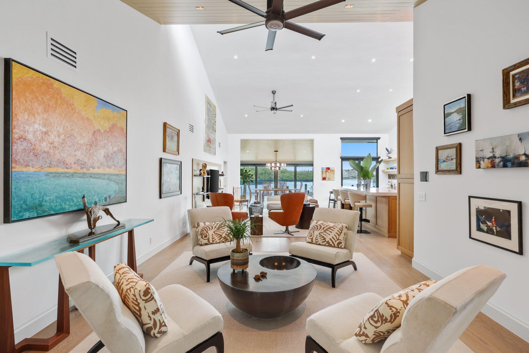 6110 North Ocean Boulevard, Unit 39 Ocean Ridge, FL 33435 - Photo 10 of 59 a living room with furniture and a large window