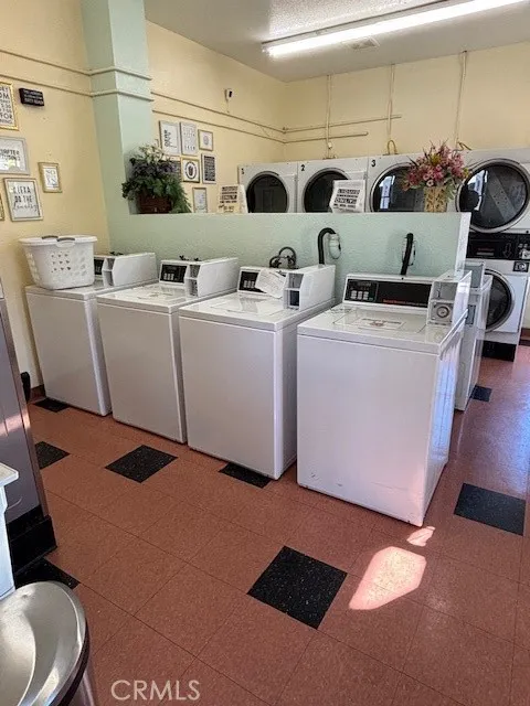 70201 Aurora Road, Unit 176 Desert Hot Springs, CA 92240 - Photo 15 of 17 a utility room with dryer and washer