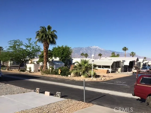 70201 Aurora Road, Unit 176 Desert Hot Springs, CA 92240 - Photo 16 of 17 a view of a city street from a cars park
