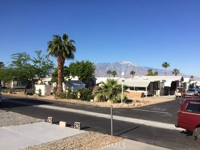 70201 Aurora Road, Unit 176 Desert Hot Springs, CA 92241 - Photo 16 of 17 a view of a city street from a cars park