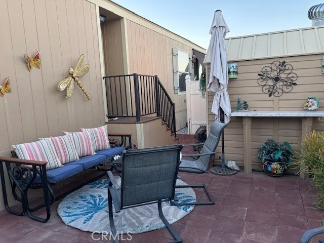 70201 Aurora Road, Unit 176 Desert Hot Springs, CA 92241 - Photo 2 of 17 a view of staircase with furniture and a potted plant